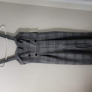 Retro romper with light grey and black stitching.